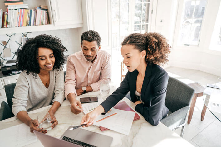 A Stellar accountant walking a couple through financial literacy documents